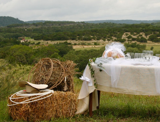 Western style wedding decorations in a pasture on the ranch